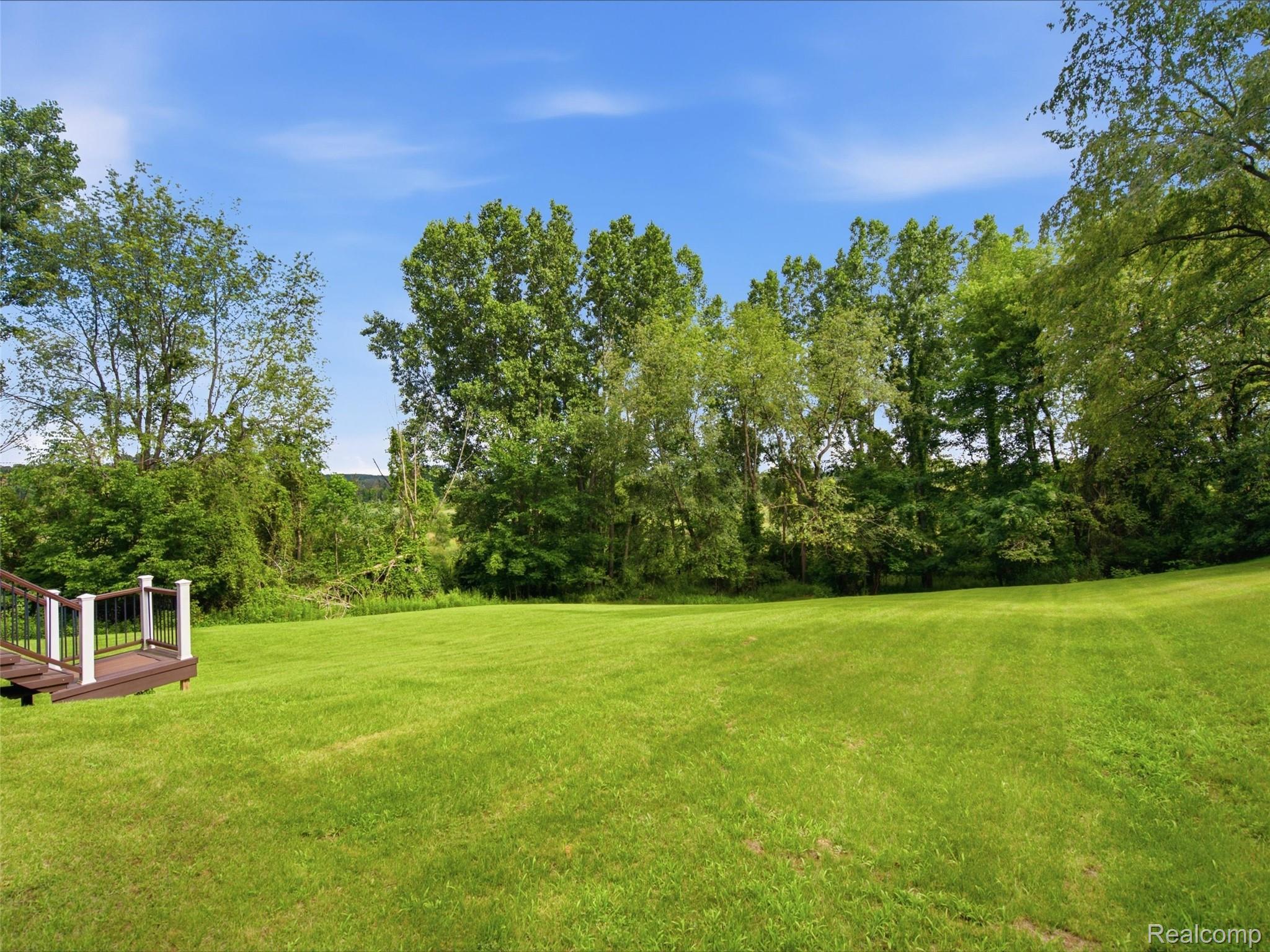 5003 Mason Road Howell, MI 48843 - Photo 35 of 59 Expansive green lawn providing abundant outdoor space
