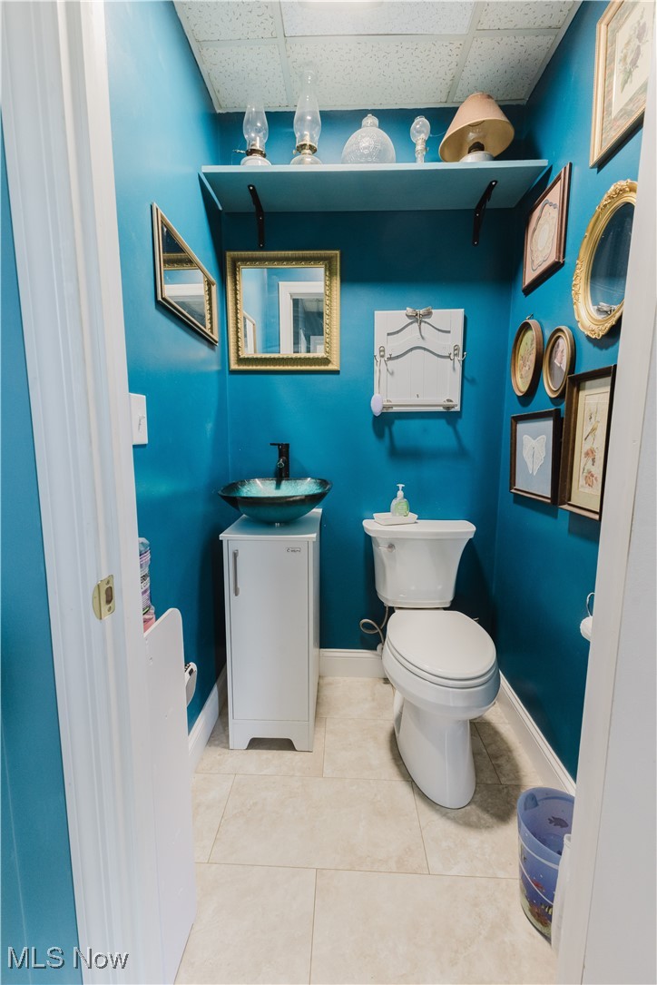 857 Archer Hill Road Colliers, WV 26035 - Photo 33 of 37 Bathroom featuring vanity, a paneled ceiling, and tile patterned flooring