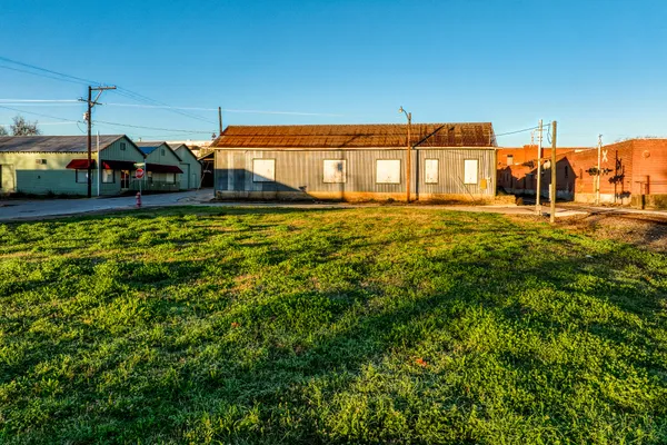 a front view of a house with a big yard