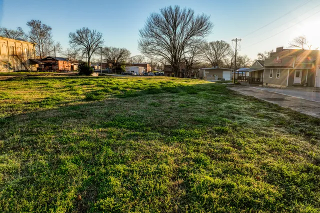 a view of a yard with an outdoor space