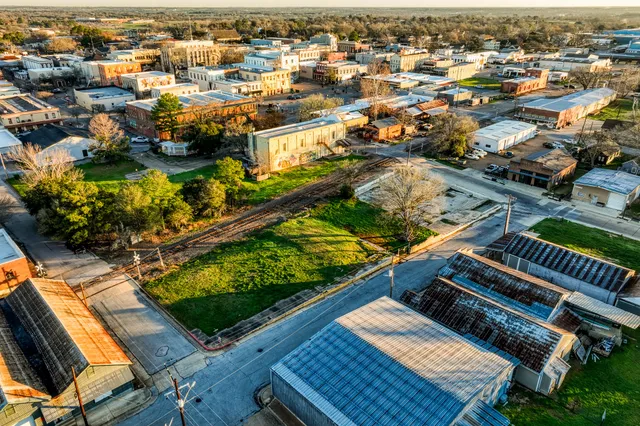 an aerial view of residential houses with outdoor space