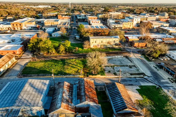 an aerial view of residential houses with outdoor space