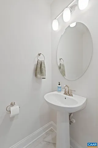 a bathroom with a sink and mirror