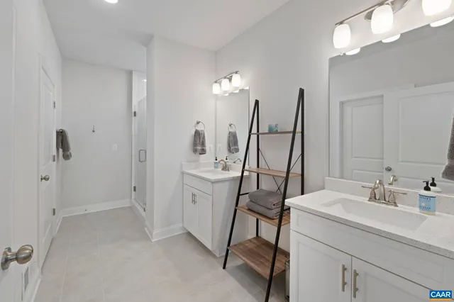 a view of walk in closet with clothes