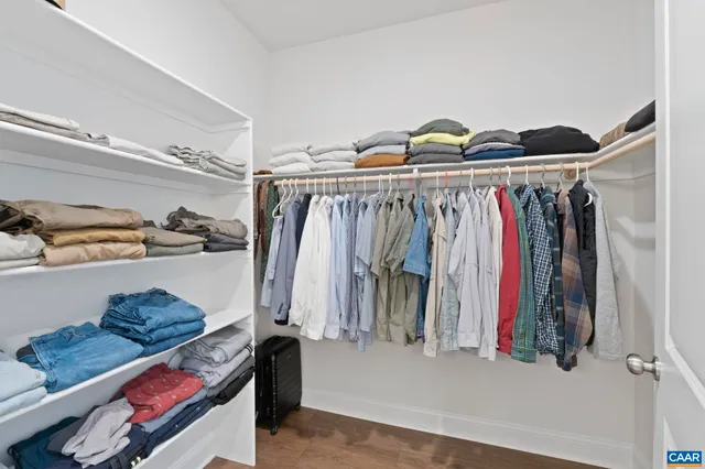 an aerial view of residential houses with outdoor space and street view