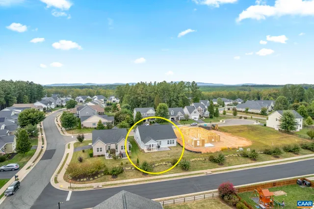 an aerial view of residential building and ocean