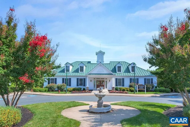 a tennis court with trees in the background