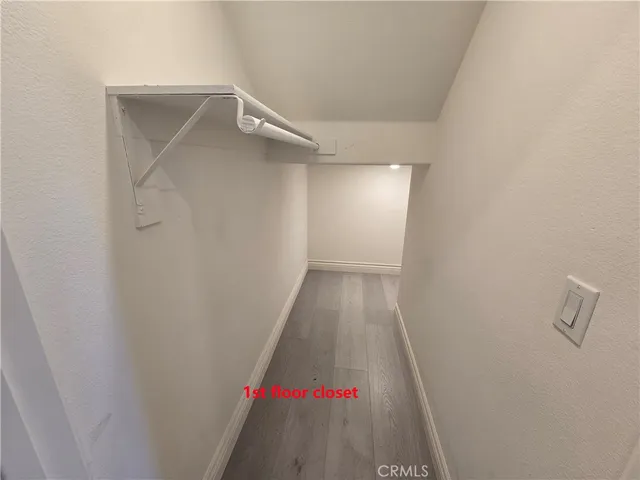 a kitchen with a sink a counter top space cabinets and stainless steel appliances