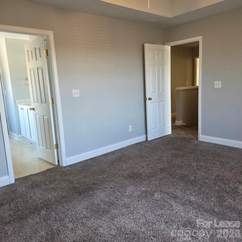 5840 Timbertop Lane Charlotte, NC 28215 - Photo 14 of 34 an empty room with windows