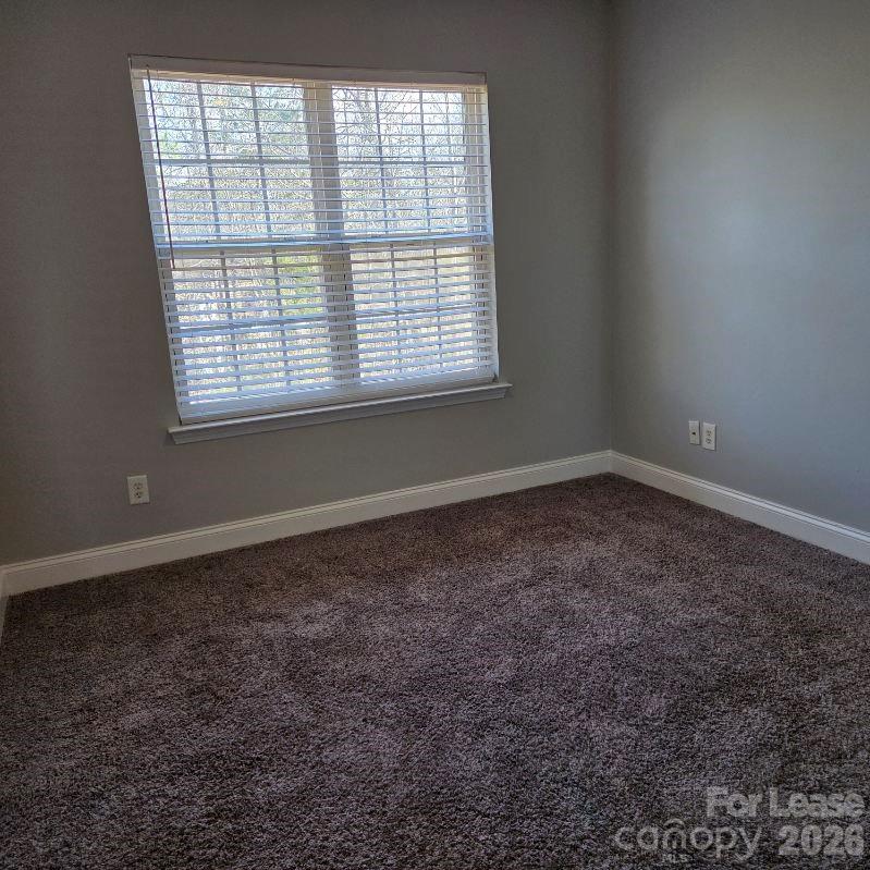 5840 Timbertop Lane Charlotte, NC 28215 - Photo 23 of 34 an empty room with a window