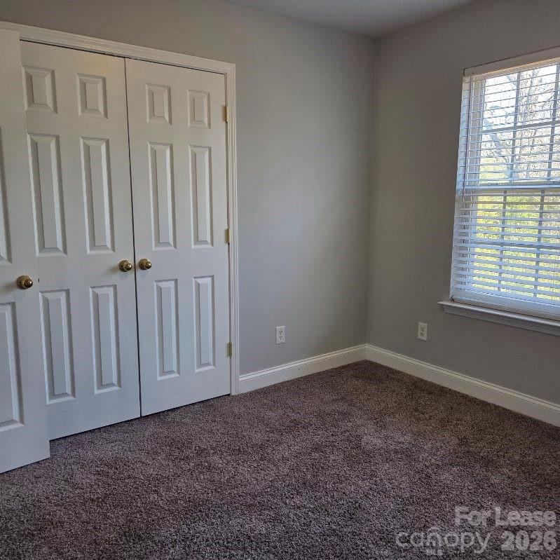 5840 Timbertop Lane Charlotte, NC 28215 - Photo 24 of 34 an empty room with a window