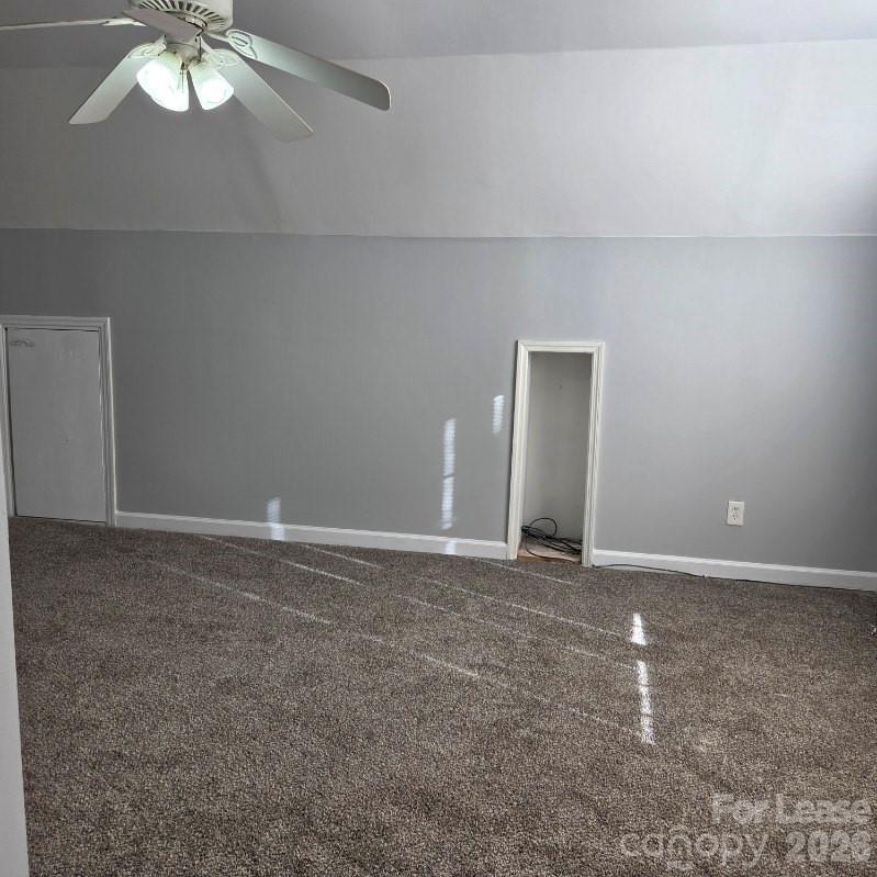 5840 Timbertop Lane Charlotte, NC 28215 - Photo 29 of 34 a view of an empty room with a chandelier fan
