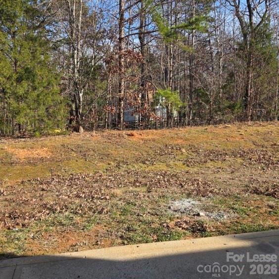 5840 Timbertop Lane Charlotte, NC 28215 - Photo 32 of 34 a view of a yard with large trees