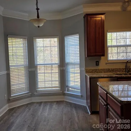 a kitchen with a stove and a window