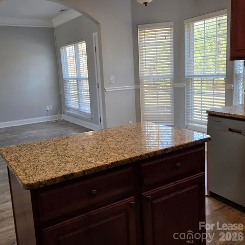 a view of kitchen island sink and window
