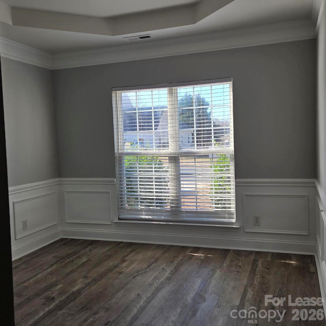 5840 Timbertop Lane Charlotte, NC 28215 - Photo 10 of 34 a view of an empty room with wooden floor and a window