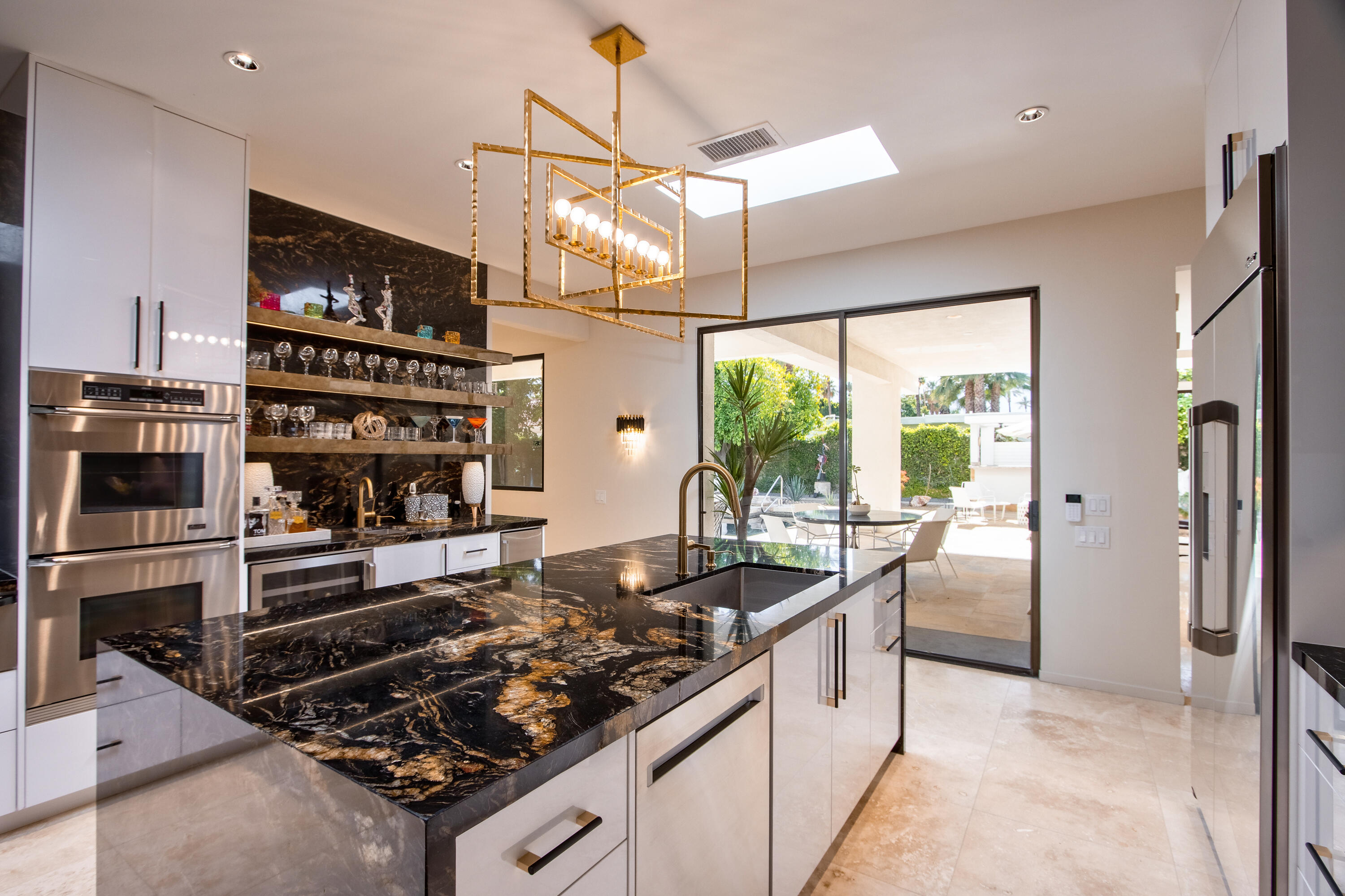 37355 Palm View Road Rancho Mirage, CA 92270 - Photo 18 of 49 a kitchen with a stove and a refrigerator