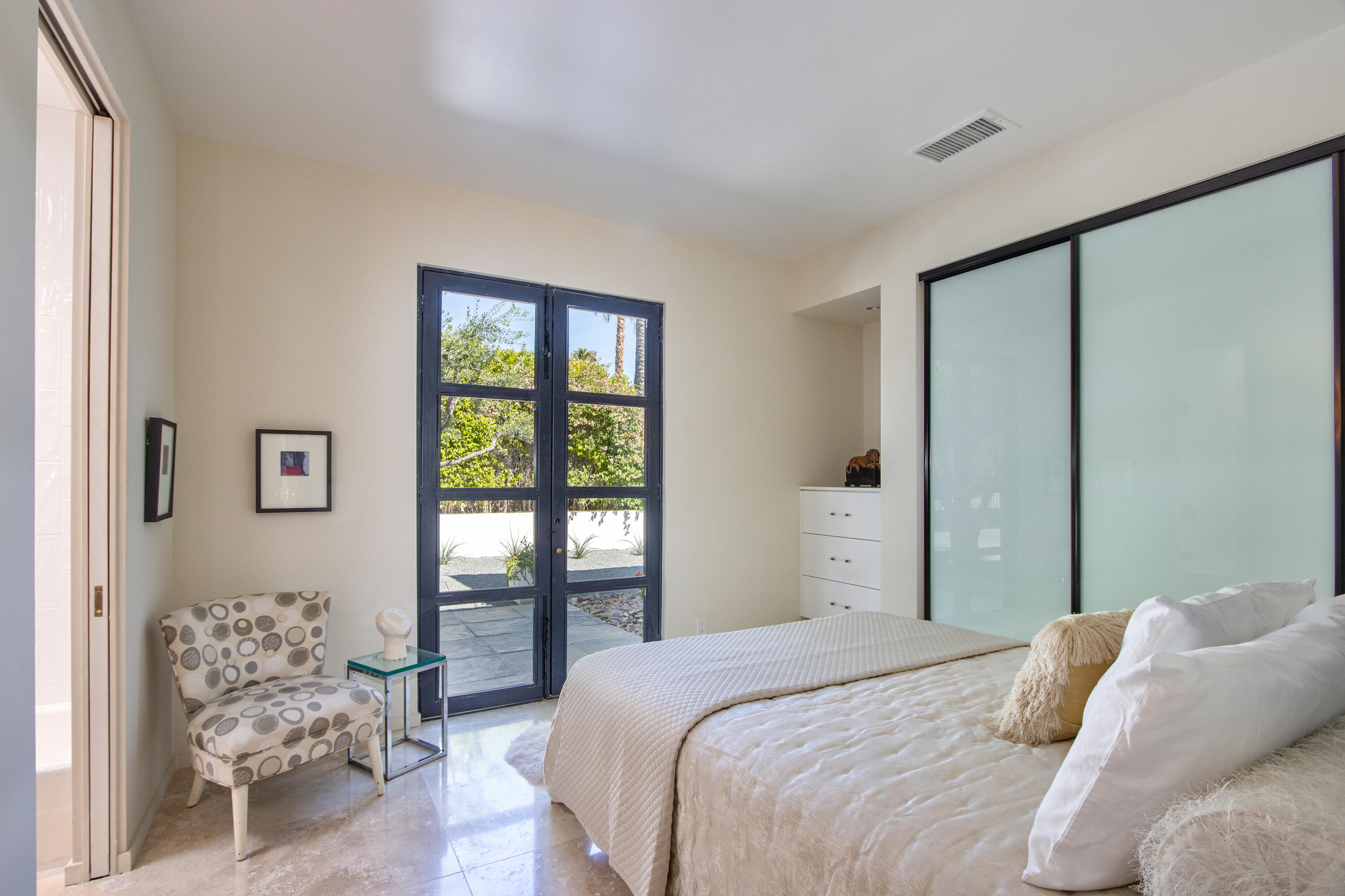 37355 Palm View Road Rancho Mirage, CA 92270 - Photo 28 of 49 a bedroom with a large bed and a window