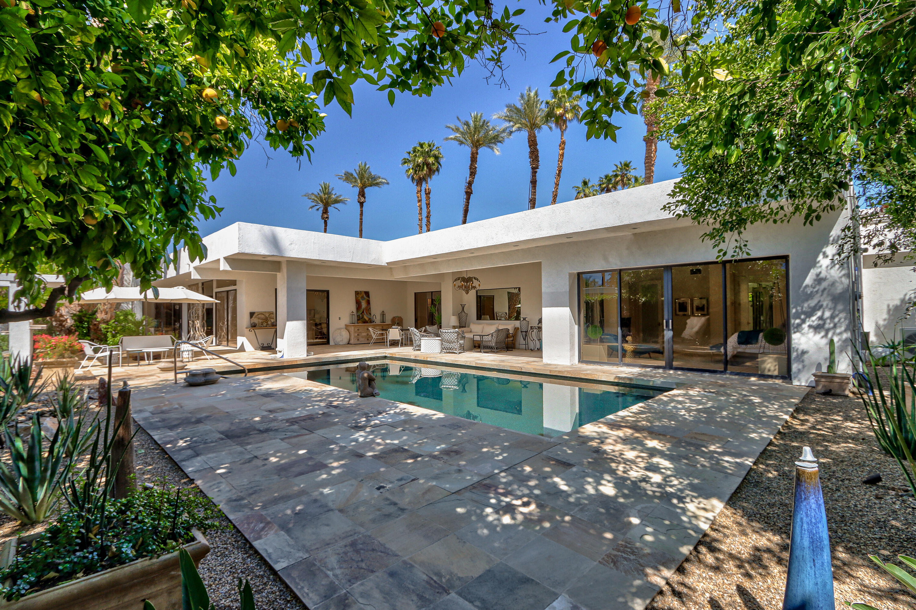 37355 Palm View Road Rancho Mirage, CA 92270 - Photo 39 of 49 a view of house with swimming pool and sitting area