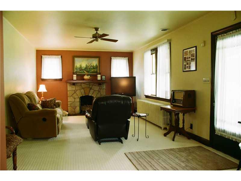 153 Easley Road Pittsburgh, PA 15237 - Photo 2 of 12 Living Room. Note the focal point in the Living Room is the 1st of 3 fireplace. This one features gas logs. Also, there is hardwood flooring hiding beneath the carpet.