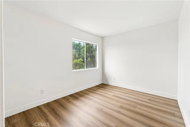 a view of a livingroom with wooden floor