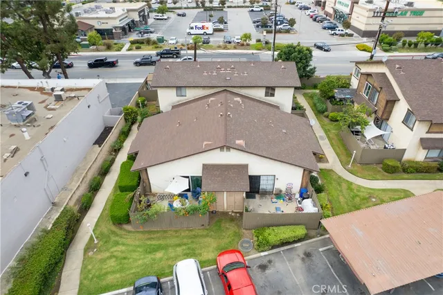 an aerial view of residential houses with outdoor space