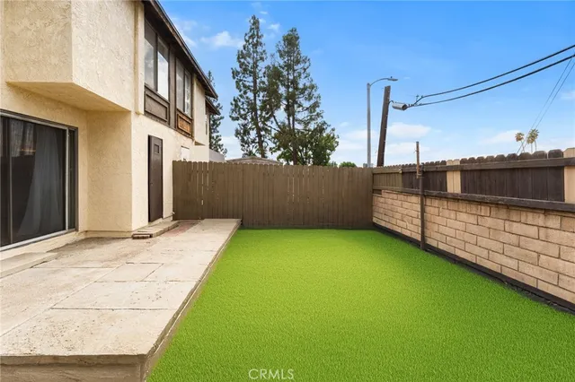 a view of front door of house with yard