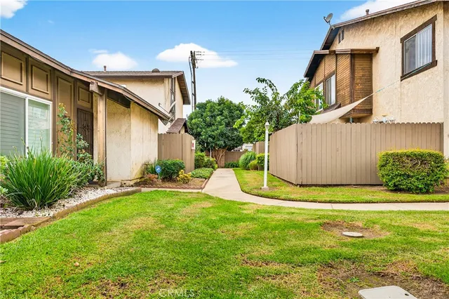 a view of a house with a yard and garage