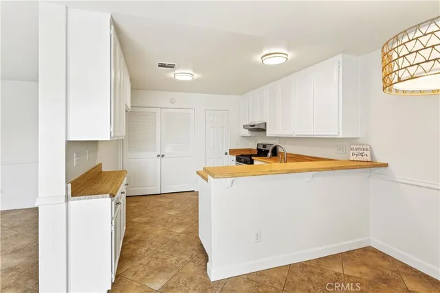 a view of a kitchen with granite countertop cabinets and a sink