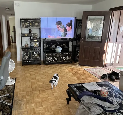 a room with furniture and a flat screen tv