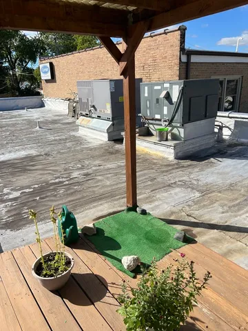 a view of a backyard with sitting area and entertaining space
