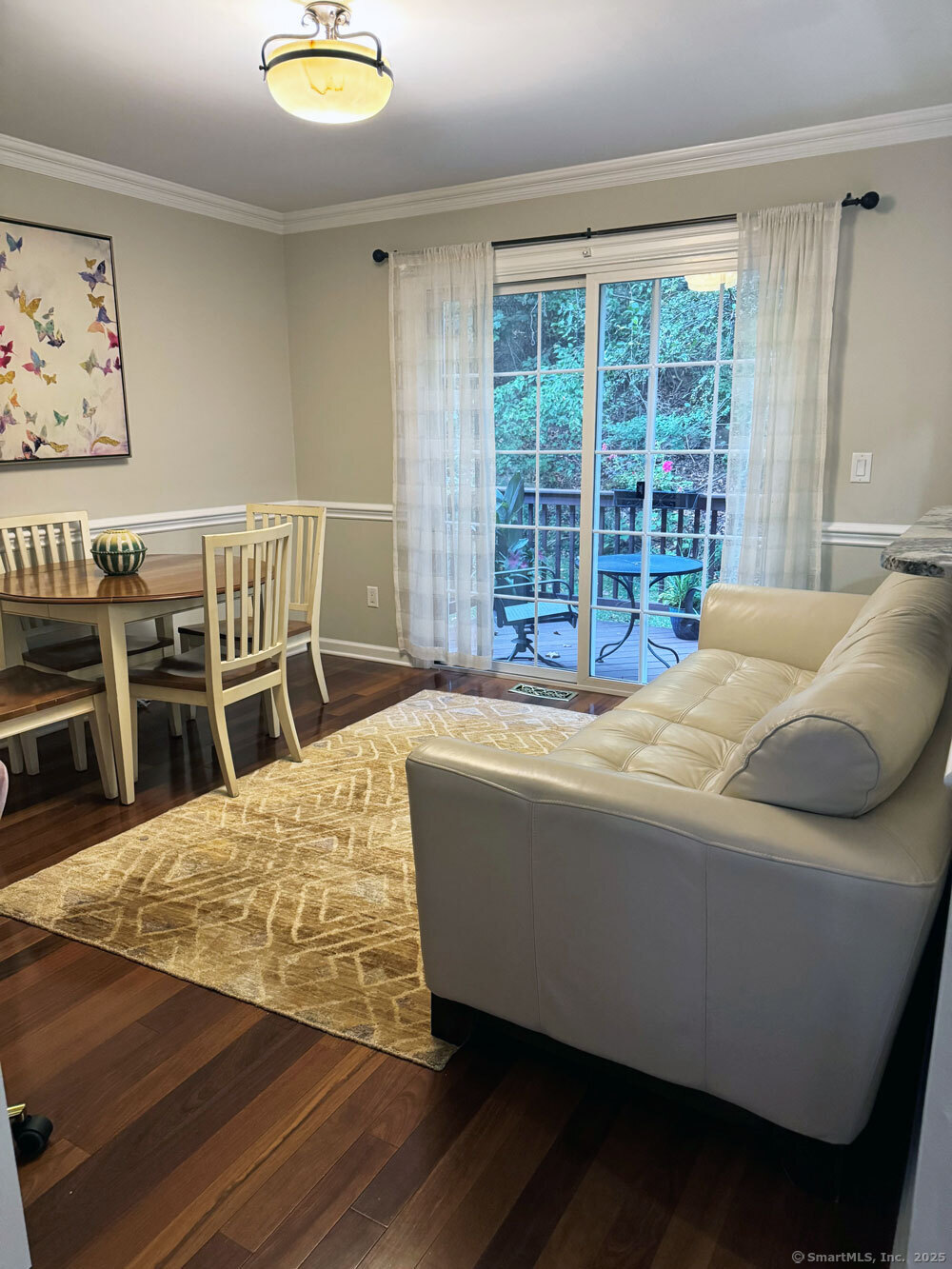 123 Governor Trumbull Way, Unit 123 Trumbull, CT 06611 - Photo 2 of 8 a bed sitting in a bedroom next to a window