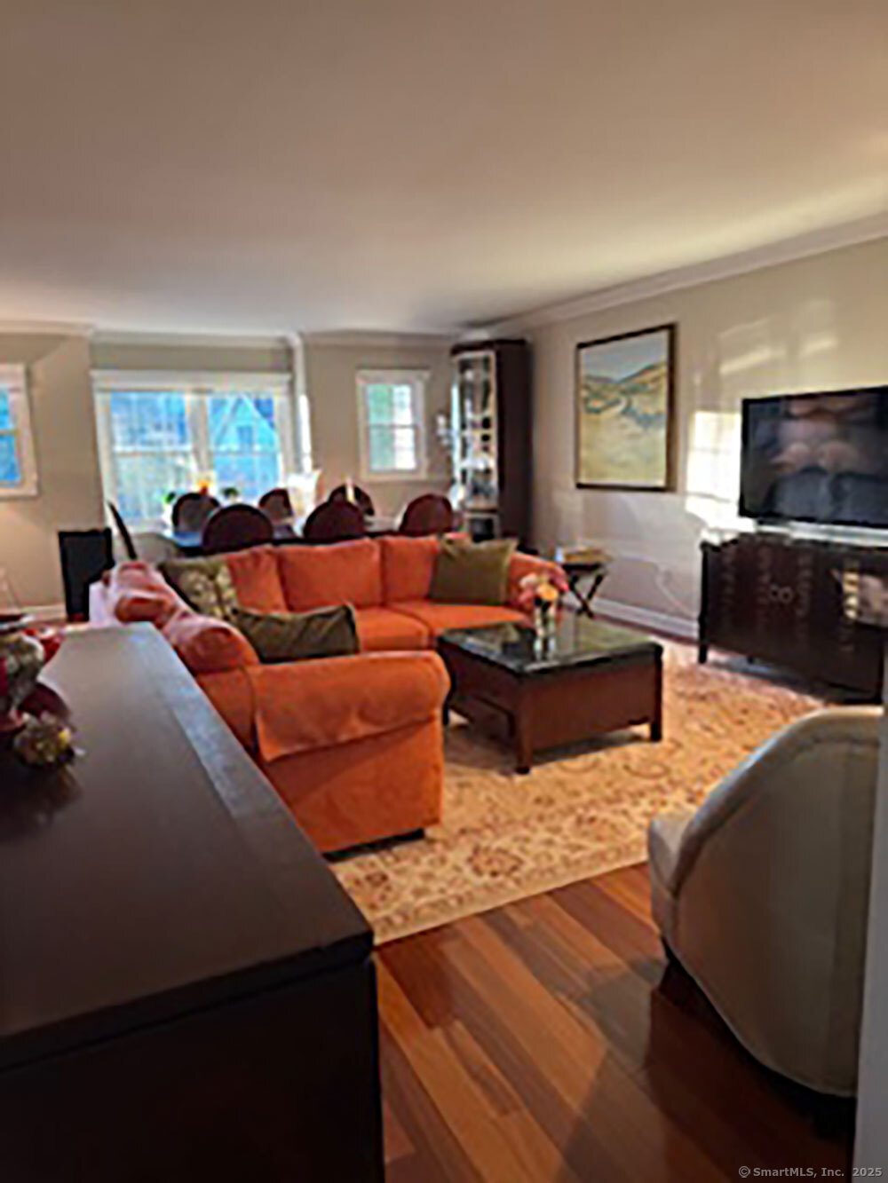 123 Governor Trumbull Way, Unit 123 Trumbull, CT 06611 - Photo 4 of 8 a living room with furniture and a flat screen tv