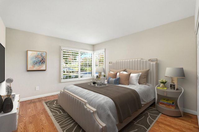 a bed room with a bed and a lamp