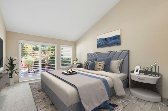 a bed room with a bed and a couch