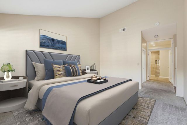 a bedroom with bed and a couch