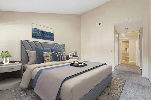 a bedroom with bed and a couch