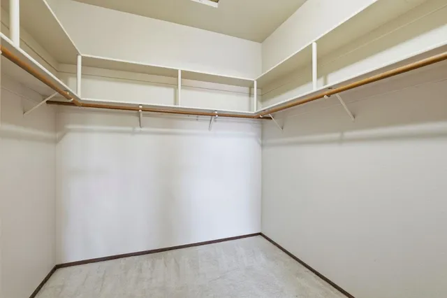 a view of an empty walk in closet