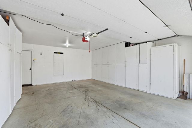 a garden with trees in front of it