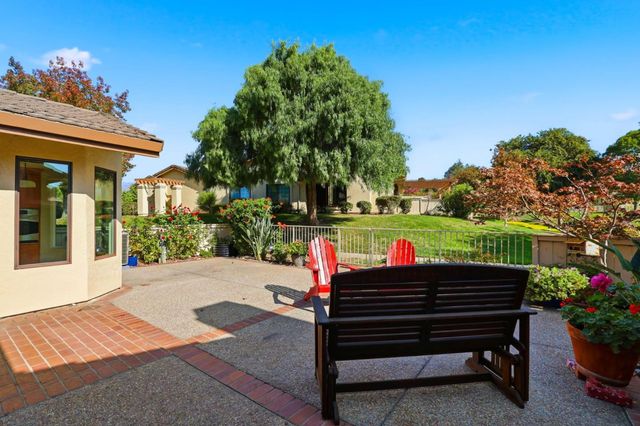 a view of a chairs and table in the patio