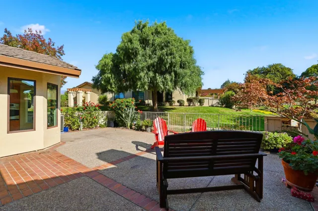a view of a chairs and table in the patio