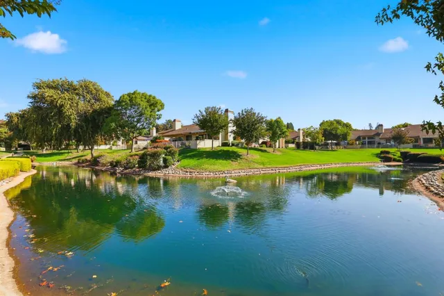 an outdoor space with lots of table and chairs
