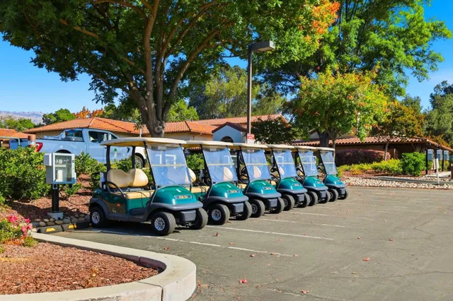 an empty room with windows and wooden floor