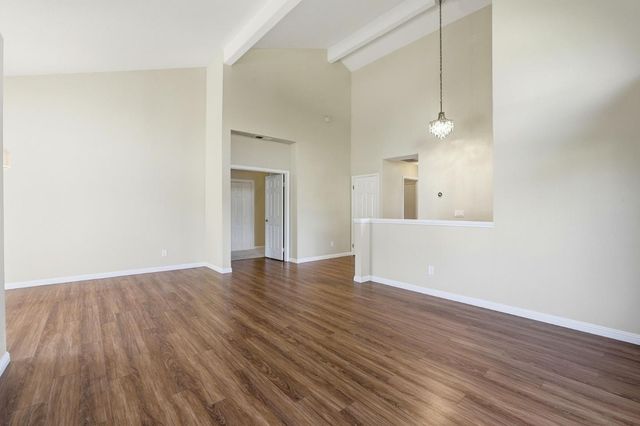 a kitchen with stainless steel appliances granite countertop a refrigerator a sink and dishwasher