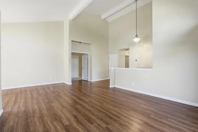 a kitchen with stainless steel appliances granite countertop a refrigerator a sink and dishwasher