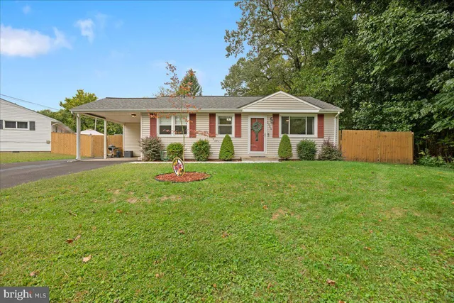 a front view of a house with a yard porch