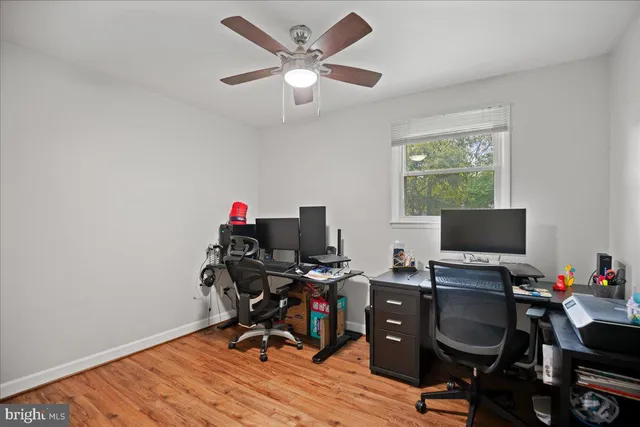 a view of a house with backyard sitting area and garden
