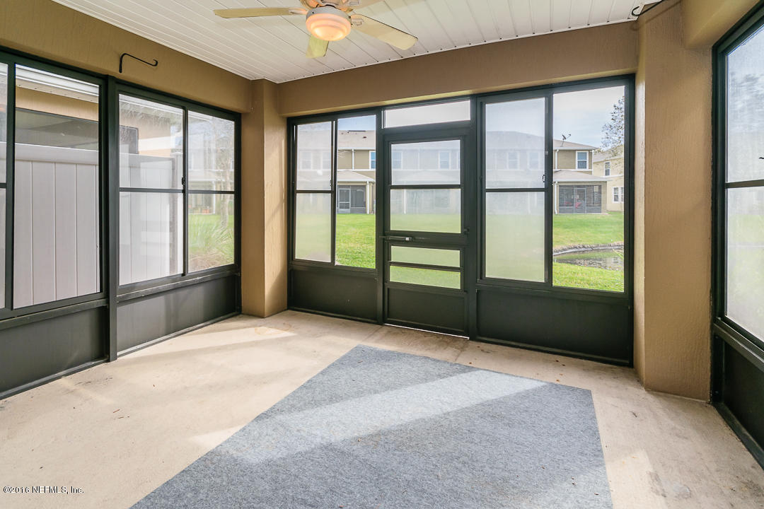 12991 Spring Rain Road Jacksonville, FL 32258 - Photo 11 of 23 a spacious bedroom with a large bed and a large window