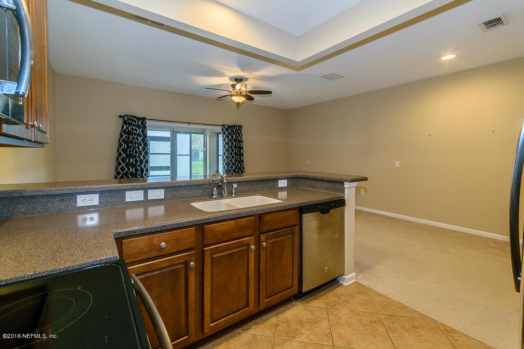 12991 Spring Rain Road Jacksonville, FL 32258 - Photo 13 of 23 a bathroom with a sink a vanity and a mirror