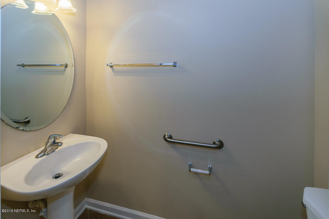 12991 Spring Rain Road Jacksonville, FL 32258 - Photo 15 of 23 a bathroom with a sink and mirror